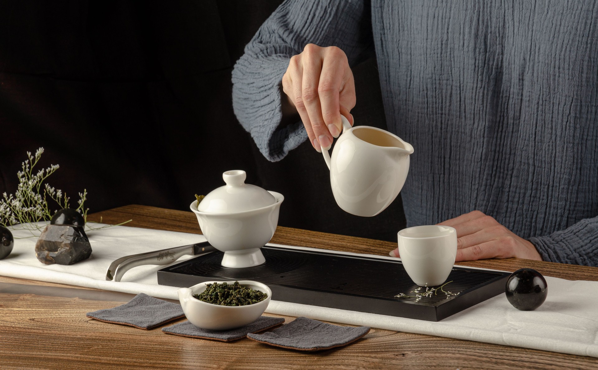 tea table with instruments teapots cups pancake and tea Shen Puer