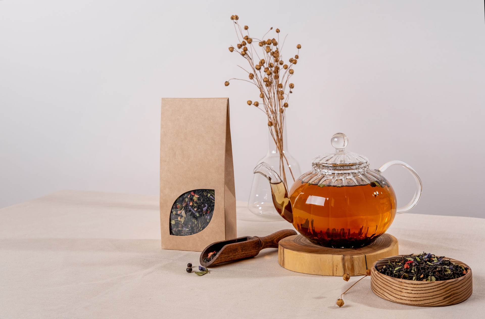 Organic tea branding and packaging mockup. Blank tea packaging mockup with tea. Kraft paper pack with window and empty space to display your branding design.